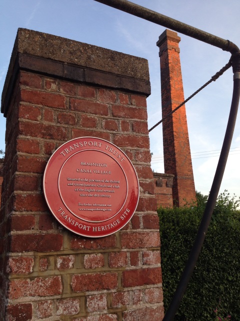 A plaque marks Braunston's canal heritage.